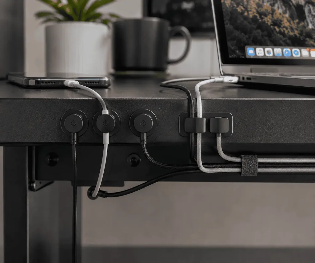 Magnetic cable clips and adhesive cable holders organizing desk cables