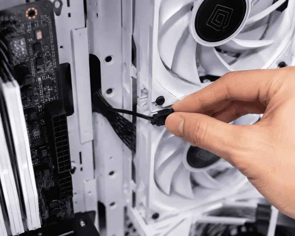 Connecting a radiator fan cable during AIO installation