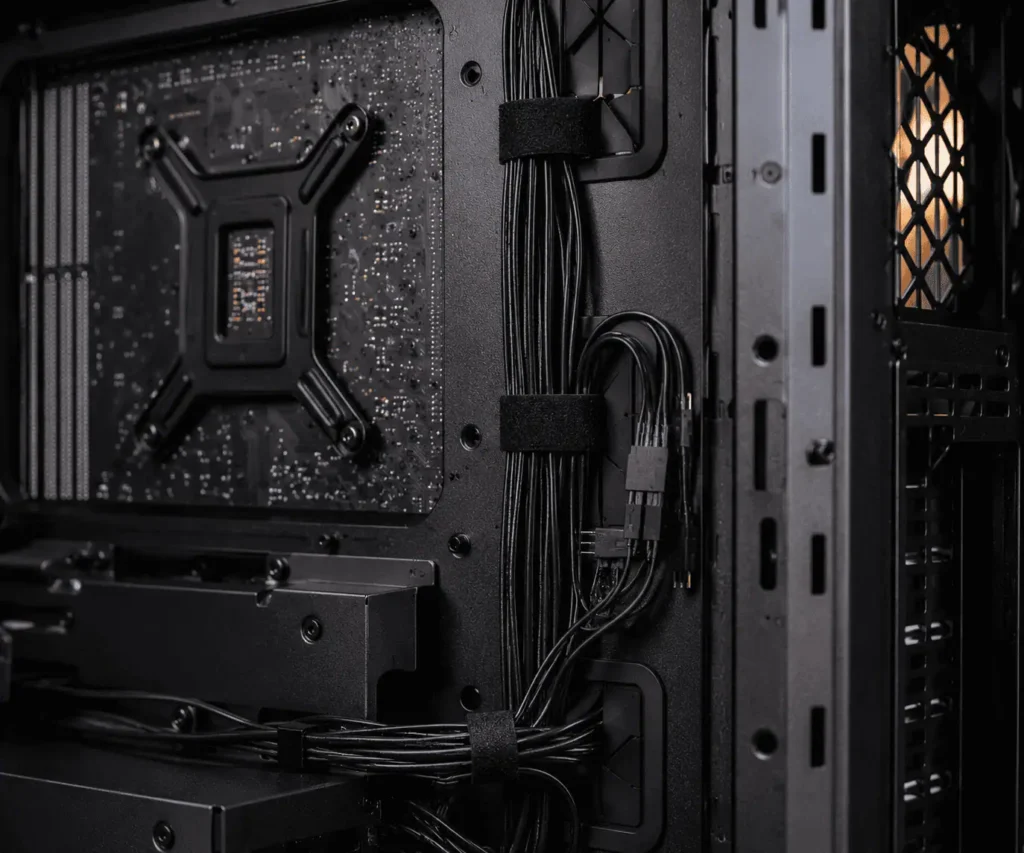 Bundled front panel header cables secured with Velcro straps inside PC case