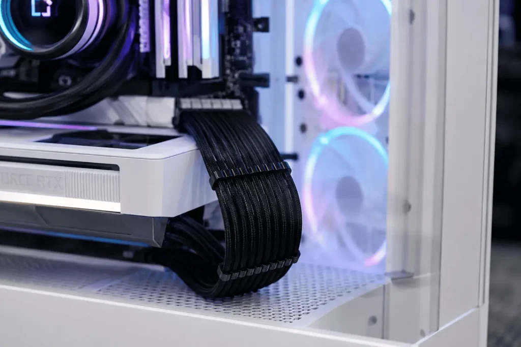 Neatly routed 24-pin ATX motherboard power cable inside a modern gaming PC