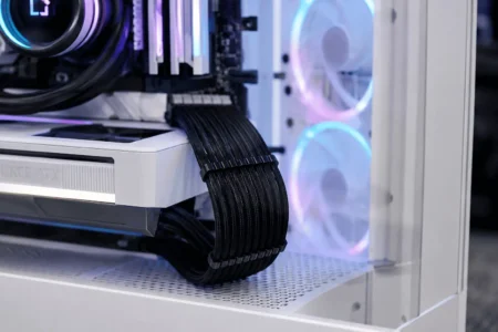 Neatly routed 24-pin ATX motherboard power cable inside a modern gaming PC