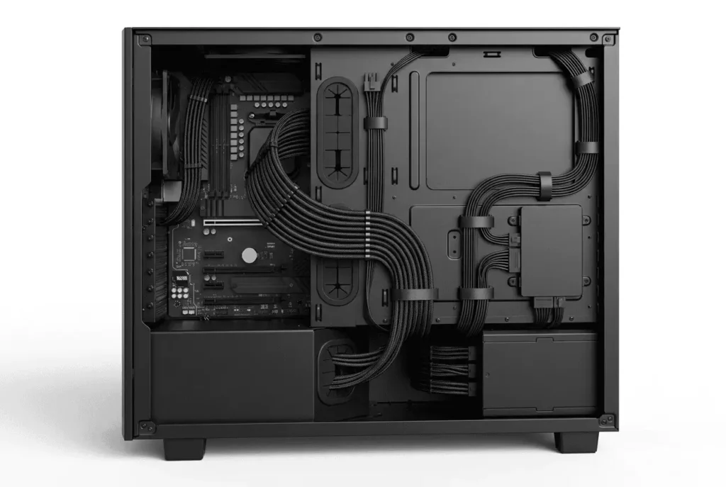 Proper PSU cable routing using cable grommets, PSU shroud, and cable combs inside a PC case.
